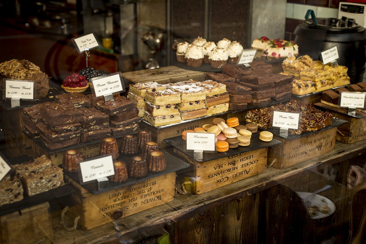 Bakery counter with brownies, cakes and macarons behind glass